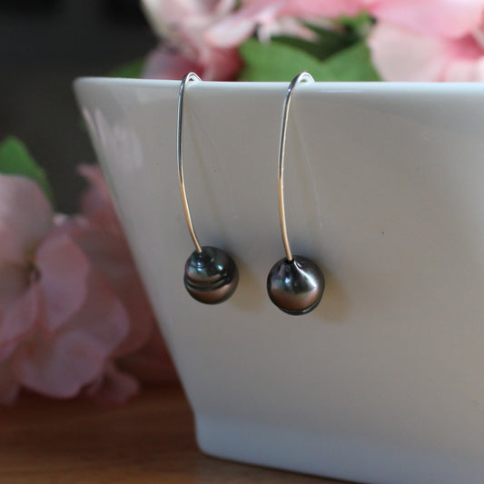 hand crafted black tahitian pearl earrings. long sterling silver earwires