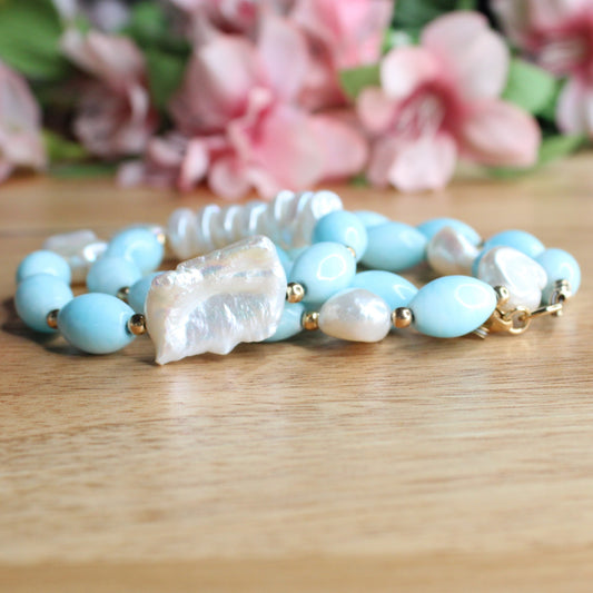 hand crafted blue aragonite and freshwater keishi pearl necklace. softly turquoise coloured aragonite oval beads, large and small keishi pearls, gold filled accent beads and lobster clasp.